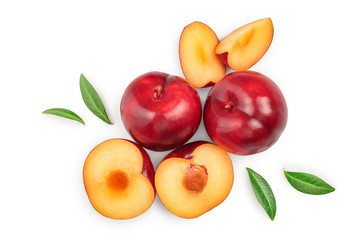 fresh red plum and half with leaves isolated on white background. Top view. Flat lay