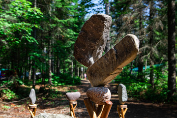 Rock balancing or stone balancing, selective focus of Balanced Stones in the forest