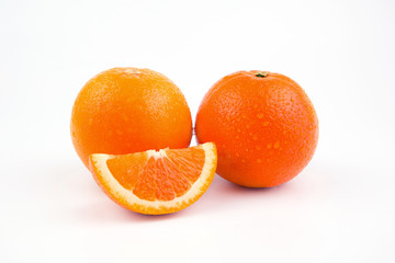 Orange fruit with drop of water isolated on white background.