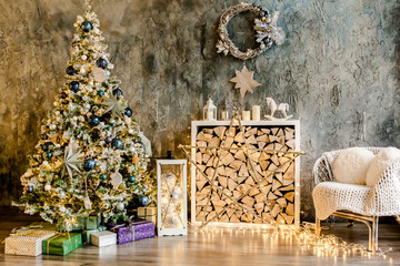 Christmas, New Year design interior of beautiful living room. Living room is decorated New Year fir tree, toys, gifts. Traditional winter holidays Christmas / New Year. 