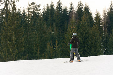 In the Ukrainian Carpathian village, children ski.