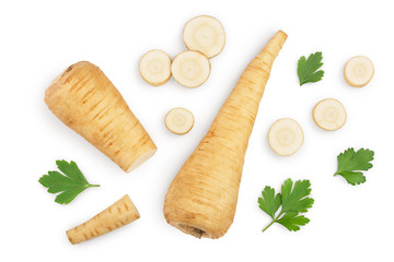 Parsnip root and slices with parsley peppercorns isolated on white background closeup. Top view. Flat lay