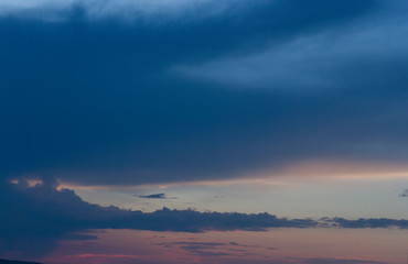 Landscape with beautiful sky at sunset and dark clouds