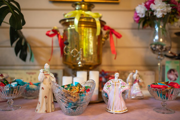 Composition of Russian toys with sweets and samovar, tea drinking traditions in Russia