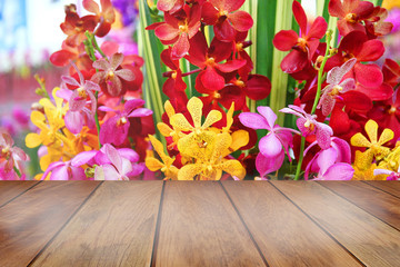 blank wood space table with Thailand colorful orchid .wooden space for display and add more value of new many product.