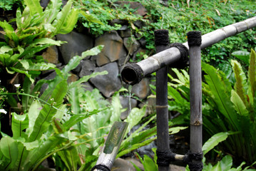 Relaxing bamboo water fountain in the traditional garden