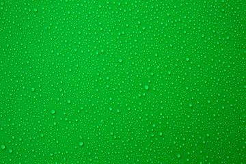 Water droplets on the green background for cool and fresh texture.