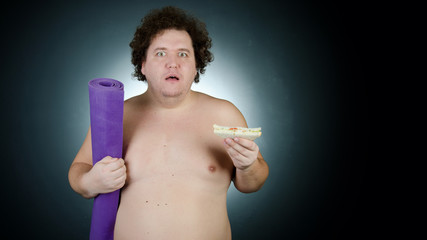 Fototapeta premium Diet and healthy lifestyle. Funny fat guy.