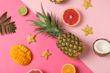 Exotic fruits on two tone background, top view