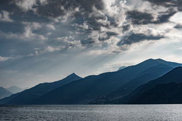 Como lake coasts in hot summer morning, Lombardy, Italy.