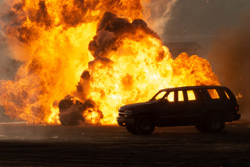 Close up of a Military strike or bomb in war on an SUV with tanks causing fire balls and explosion...