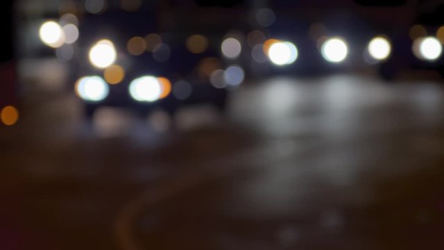 Night traffic on the road and moving cars. Blurred bokeh background for use as green screen background plate for interviews. Perfect for keying or compositing.