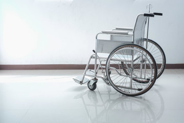 Fototapeta na wymiar Wheelchair Against White Background