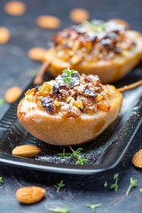 Pears baked in honey with raisins and nuts.