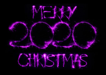 2020 in neon multi colour design, parallel lines pattern on black background. Holidays, celebrating night, New Year and Christmas event, bright colors. Copyspace, advertising.