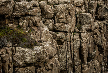 Mountains stone wall as background.