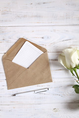 Notebook with pen and rose