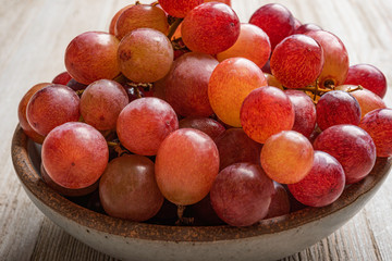 Grapes In A Bowl On Wood Table