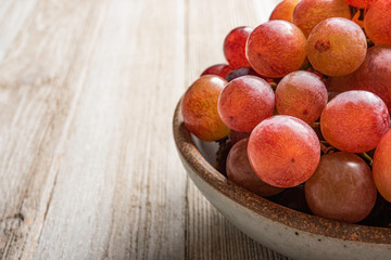 Grapes In A Bowl On Wood Table