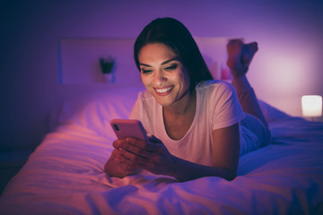 Close-up portrait of her she nice attractive charming cute lovely cheerful cheery girl lying on bed...