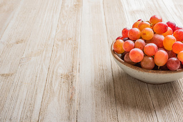 Grapes In A Bowl On Wood Table