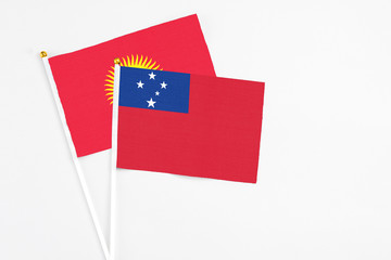 Samoa and Kyrgyzstan stick flags on white background. High quality fabric, miniature national flag....
