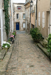 empty street with classic architecture of Normandy hosues in the old city of Granville