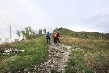 Tourists go on a footpath uphill