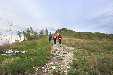 Tourists go on a footpath uphill
