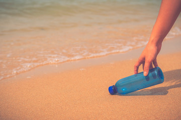 Garbage or bottle on the beach. Clean, beach, up.
