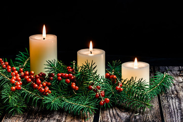 Obraz na płótnie Canvas Christmas candle on black background 