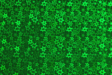 Background from holographic wrapping paper. Selective focus. Christmas background.