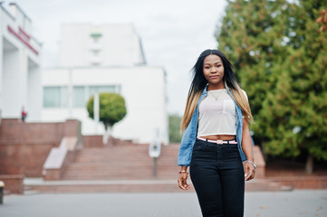 Young black female posed in the city. African women single portrait.