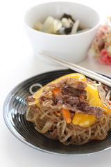Korean food, yellow paprika and beef Japchae glass noodles