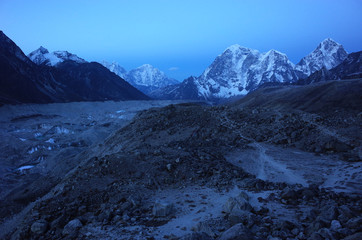 Everest base camp trek trail along Khumbu glacier with view of Tabuche Peak, Cholatse and Arakam Tse. Early morning before sunrise in Himalayas mountains, Sagarmatha national park, Solukhumbu, Nepal