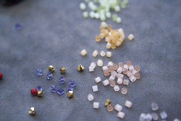 Closeaup photo of beads, thread and jewelry making asseccories