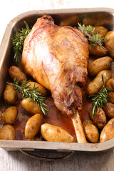 roasted lamb leg with potatoes and rosemary