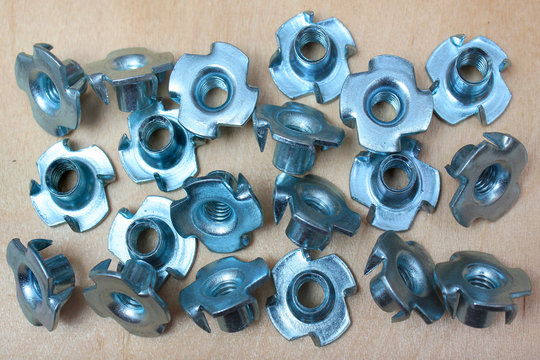 Pronged tee nuts for wood. Steel threaded rivet nuts.