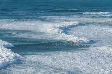 Foamy Atlantic ocean wave at Portugal coast.