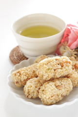 Asian confectionery, rice cracker on dish with copy space