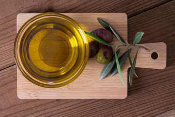 bowl of extra virgin olive oil with olives