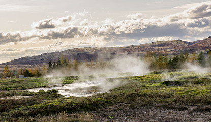 Icelandic Geyser Strokkur. visible geyser valley Great tourist attraction on Golgen Circle Iceland.