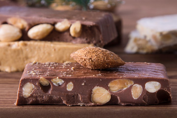 nougat, typical Christmas dessert on wooden background