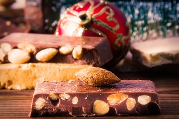 nougat, typical Christmas dessert on wooden background