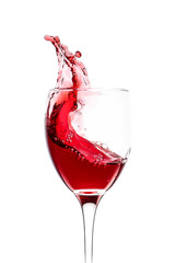 Glass of wine with splash on white background