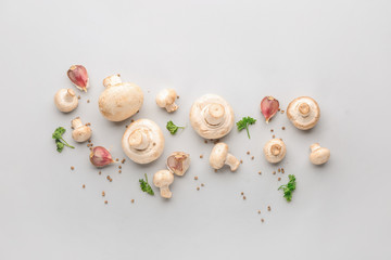 Fresh mushrooms with spices on white background