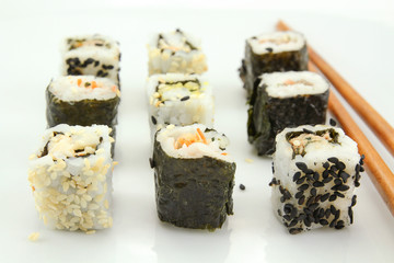 several makis on a white background	