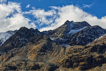 Fototapeta na wymiar Mountain peak with blue sky