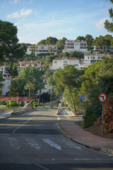 View of Traditional Spanish street in city of island Menorca - obrazy, fototapety, plakaty