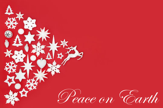 Christmas Peace On Earth Abstract Background With White And Silver Tree Decorations And Symbols On Red With Copy Space. Traditional Theme For The Festive Season.